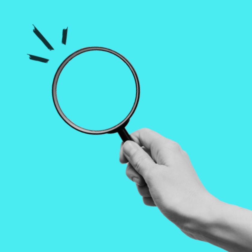A greyscale magnifying glass on a aqua blue background
